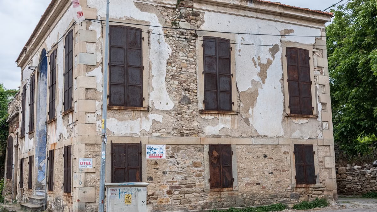 A vintage, rustic stone building with distressed facade in Foça, İzmir, Turkey.